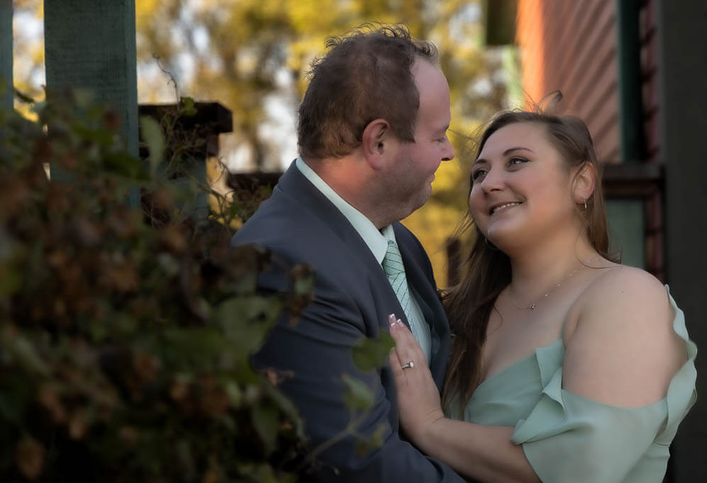 Portrait of a man and a woman gazing into each others eyes happy.